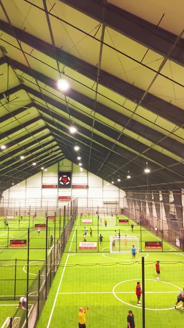 Soccer 5 indoor fields with games going on every pitch