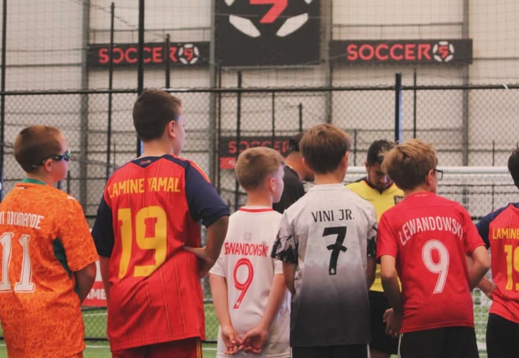 Soccer 5 indoor fields with games going on every pitch